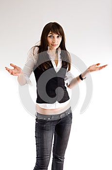 Young woman shrugging her shoulders