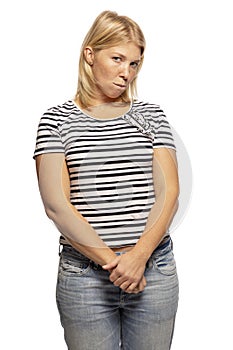 Young woman in shy pose isolated on white background