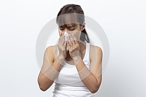 Young woman sick having allergy and sneezing in tissue isolated on a white background