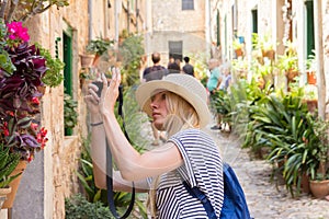 Young woman sightseeing and photographing