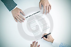 Young woman signing a last will and testament document