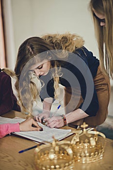 Young woman signs a contract