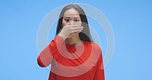 Young woman silencing herself