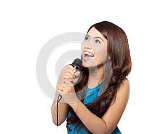 Young woman sing holding a mic, isolated