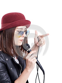 A young woman singing with a microphone