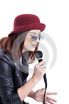 A young woman singing with a microphone