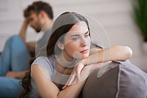 Young woman sit looking upset after a bad talk with her husband