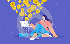 Young woman sitting alone and buying or selling bitcoins on laptop