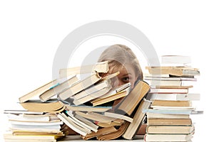 Young woman sitting behind books