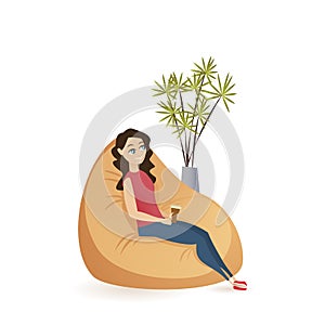 Young Woman Sitting Calm in Brown Beanbag Chair