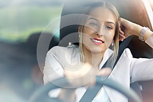 Young woman sitting in a car