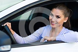 Young woman sitting in a car