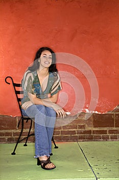 Young Woman Sitting in Chair