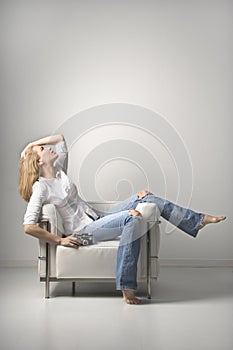 Young Woman sitting on chair. Isolated