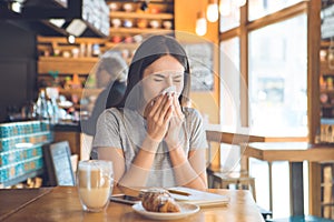 Young woman sitting in a coffee shop leisure photo