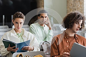 young woman sitting with copybooks near