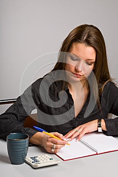 Young woman sitting at desk