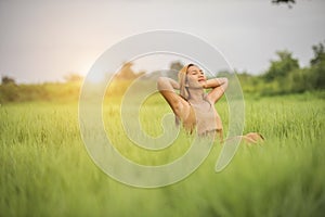 Young woman sitting feel good