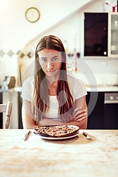 Young Woman Is Unhappy With Her Burnt Pizza For Lunch
