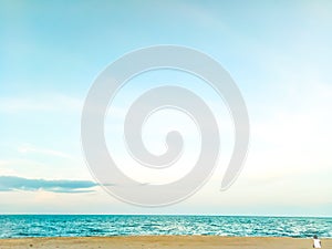 Young woman sitting on a rock, gazing in the distance, looking in the sea.loneliness.alone.relax concept idea for holiday