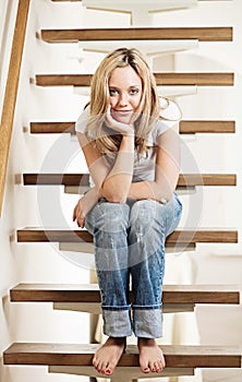 Young woman sitting on steps