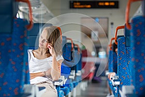 Young woman sitting in the train