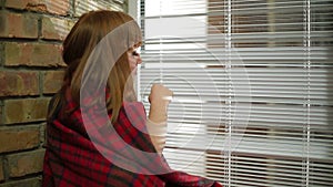 Young Woman Sitting At Window