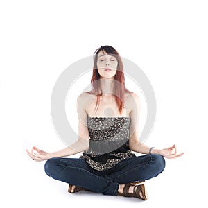 Young Woman Sitting in Yoga Pose with Eyes Closed