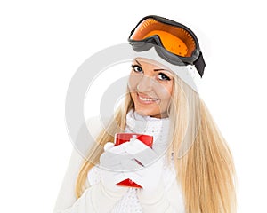 Young woman in ski glasses with red cup.