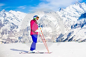 Young woman skiing in the mountains.