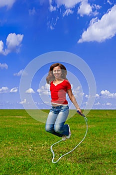 Young woman with skipping rope