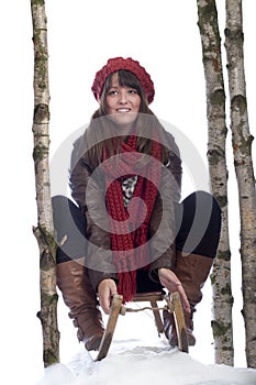 Young woman on a sledge