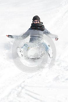 Young woman sledging in deep snow, concept winter and sleigh rid