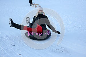 A Young Woman Sledging Down Hill Bright and Joyful Winter Scene.