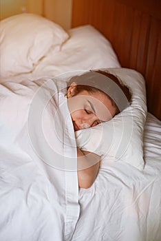 Young woman sleep in bed