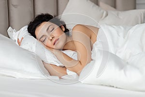 Young woman sleep  on white pillow