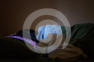 Young woman is sleeping from the back in bed