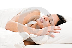 Young woman sleeping on bed