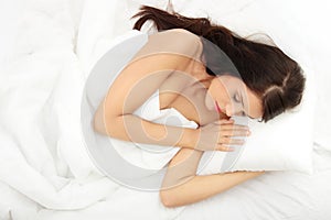 Young woman sleeping on the bed