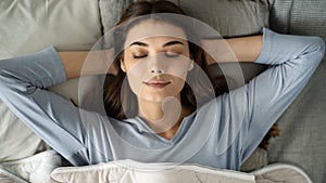 Young woman sleeping on the bed