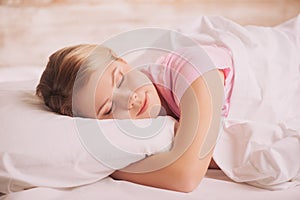 Young woman sleeping in bed