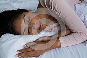 Young woman sleeping on bed