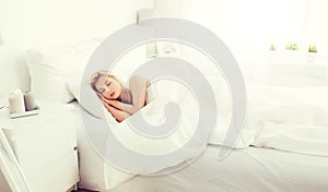 Young woman sleeping in bed at home bedroom