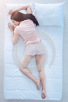 Young woman sleeping in freefall position