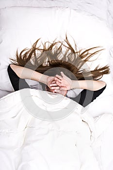 Young woman is sleeping in her bed. photo