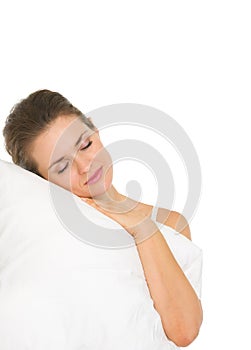 Young woman sleeping on pillow isolated on white