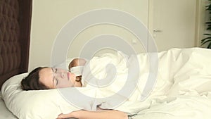 Young woman sleeping on uncomfortable bed