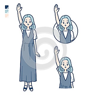 A young woman in a sleeveless dress with raise hand images