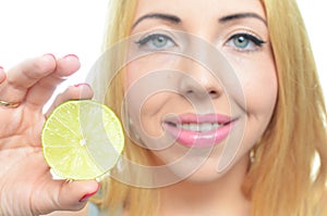 Young woman with sliced lime
