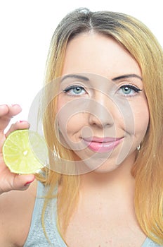 Young woman with sliced lime